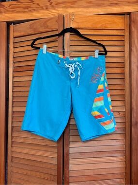 Volcom Teal Blue women’s Swim Boardshorts with Multicolor Stripe Panel